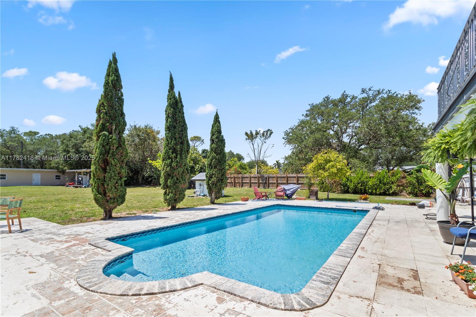 8350 Southwest 98th Street Miami, FL 33156 - Photo 38 of 67 a view of a swimming pool with a patio