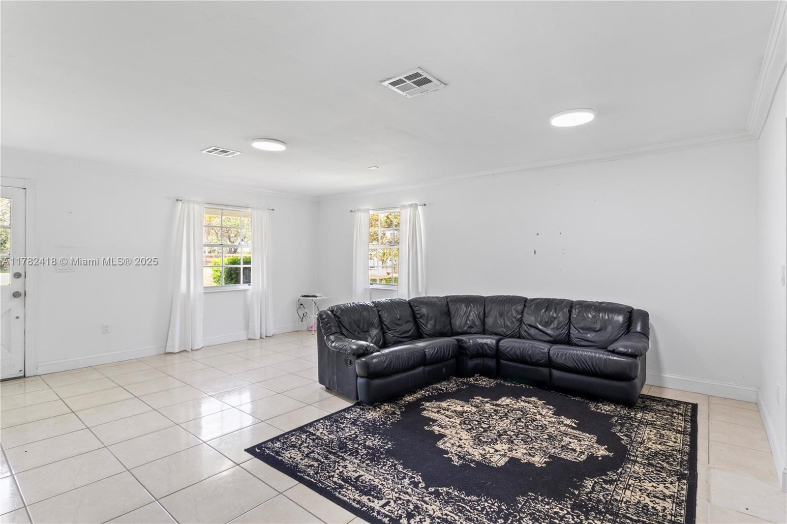 8350 Southwest 98th Street Miami, FL 33156 - Photo 42 of 67 a living room with a couch