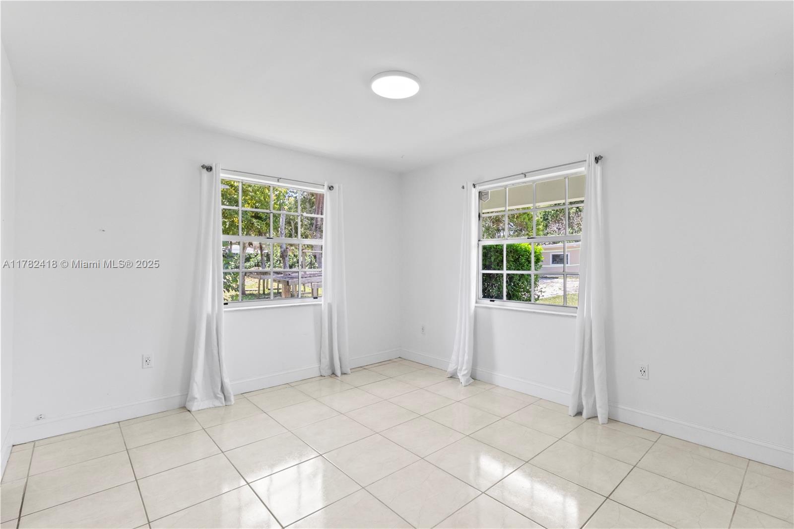 8350 Southwest 98th Street Miami, FL 33156 - Photo 43 of 67 an empty room with windows