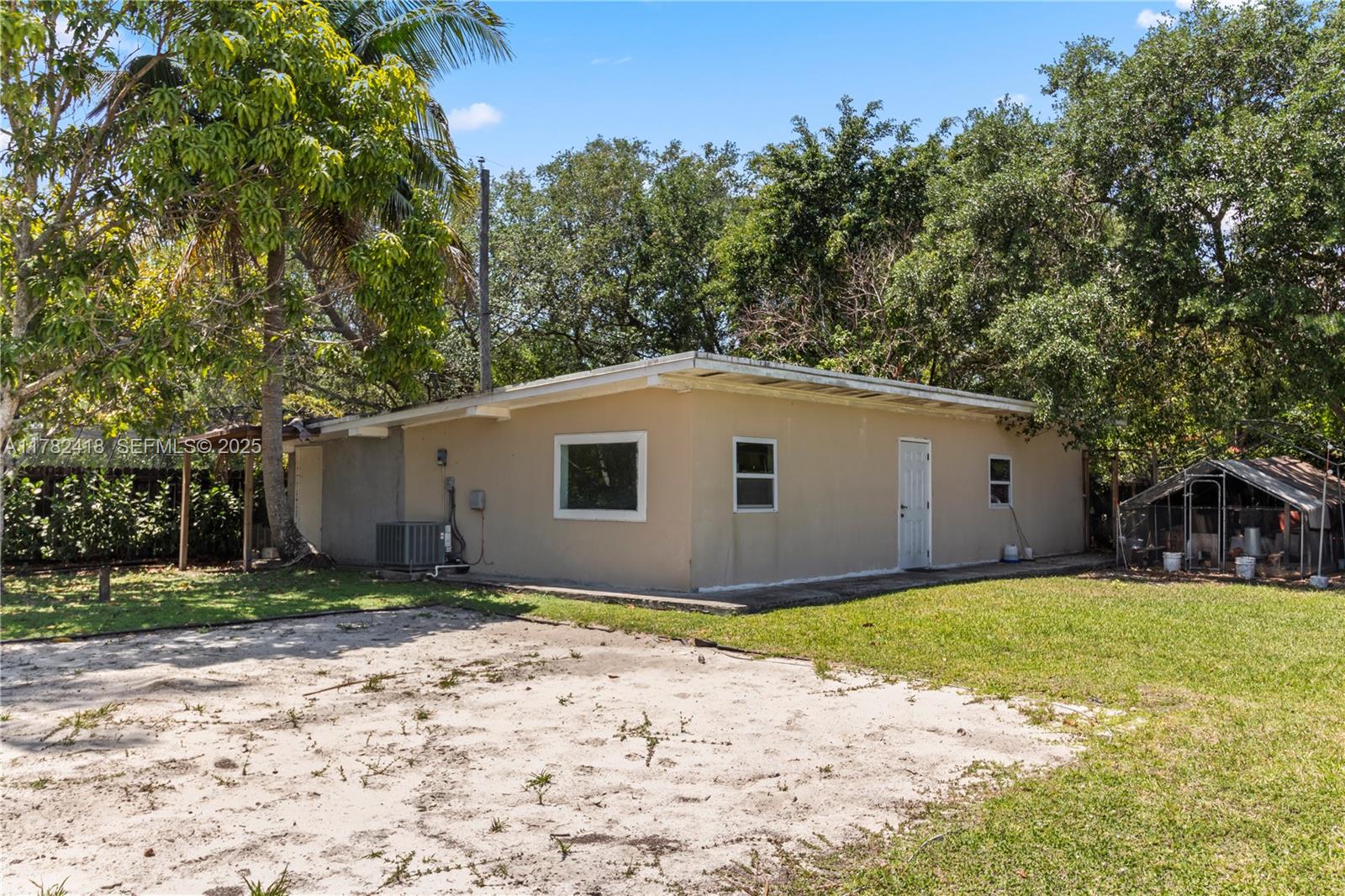 8350 Southwest 98th Street Miami, FL 33156 - Photo 47 of 67 a house with tree in front of it