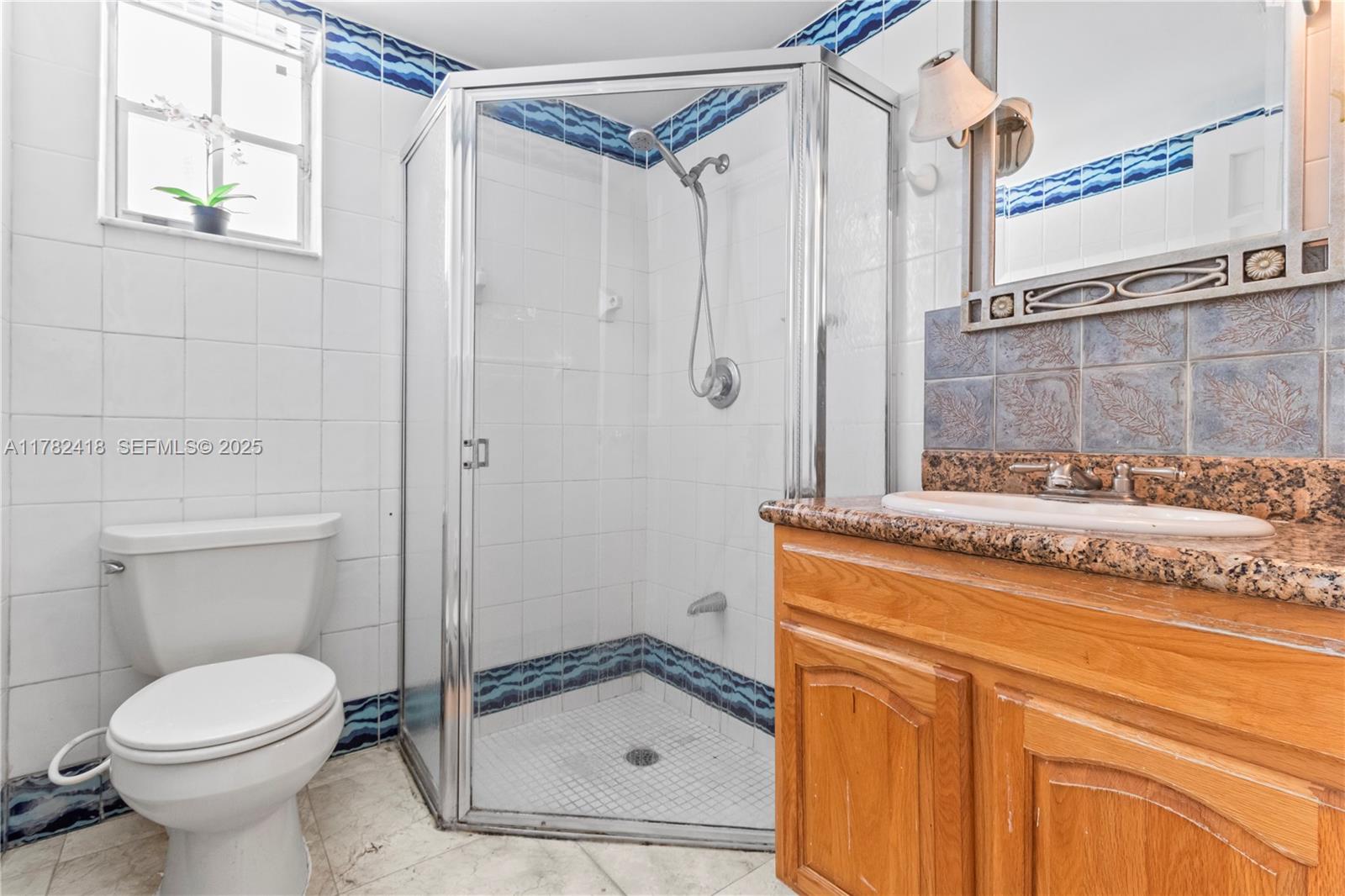 8350 Southwest 98th Street Miami, FL 33156 - Photo 50 of 67 a bathroom with a granite countertop sink toilet and shower