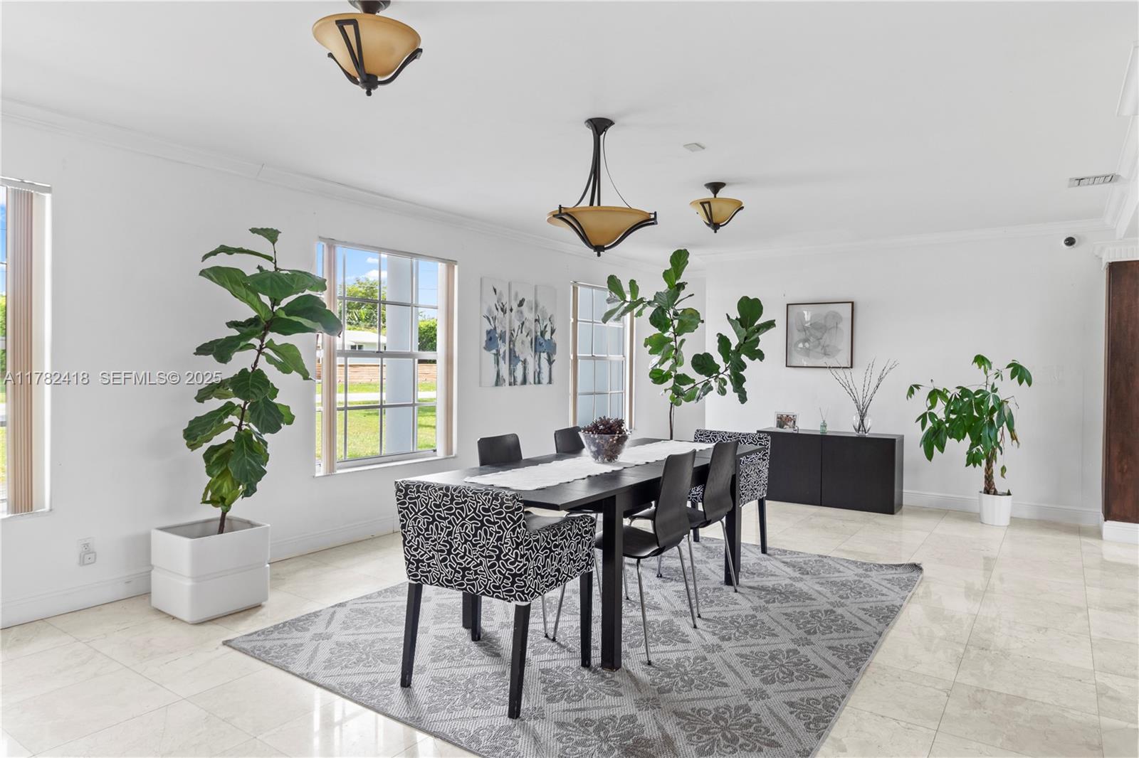 8350 Southwest 98th Street Miami, FL 33156 - Photo 5 of 67 a view of a dining room with furniture window and wooden floor