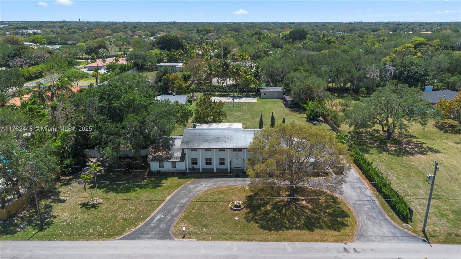 8350 Southwest 98th Street Miami, FL 33156 - Photo 53 of 67 an aerial view of a house with a yard