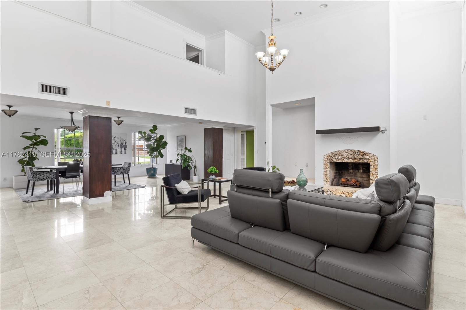 8350 Southwest 98th Street Miami, FL 33156 - Photo 6 of 67 a living room with furniture and a fireplace