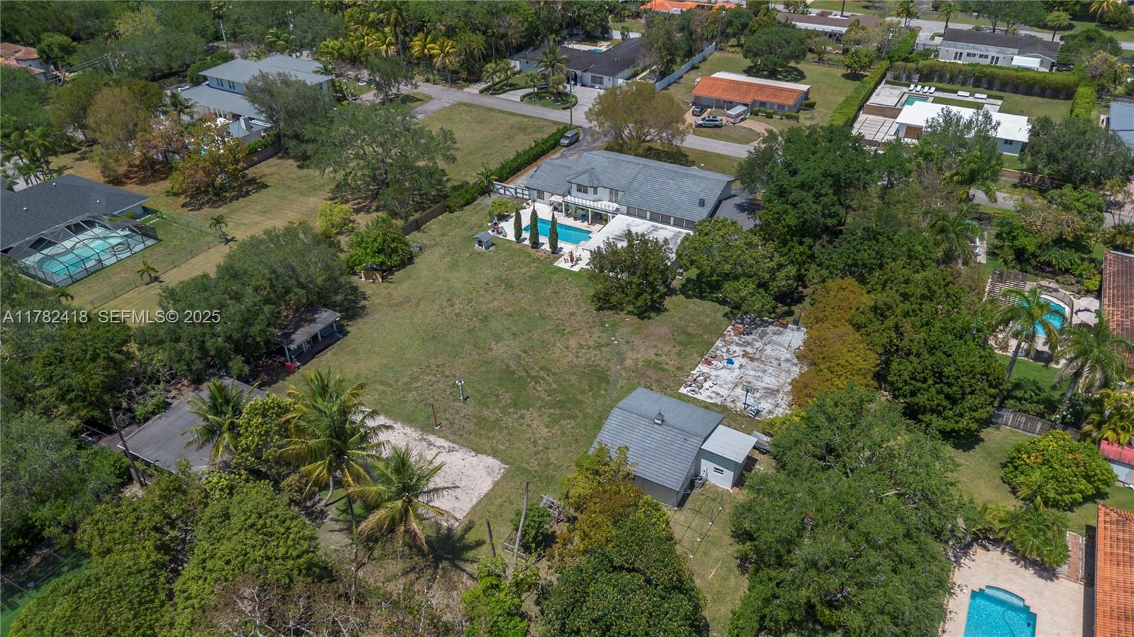8350 Southwest 98th Street Miami, FL 33156 - Photo 63 of 67 an aerial view of a house with a yard