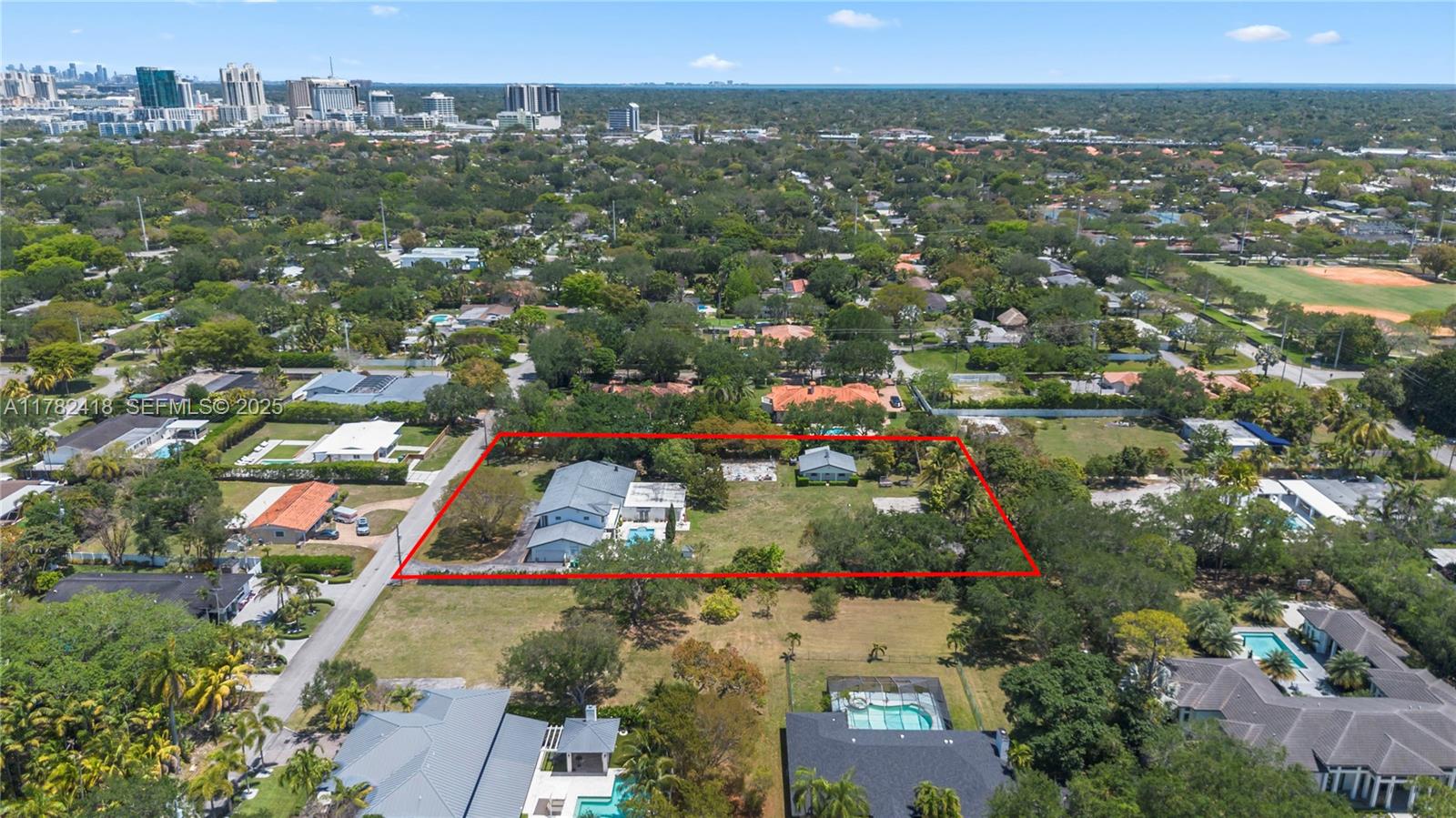 8350 Southwest 98th Street Miami, FL 33156 - Photo 65 of 67 an aerial view of residential houses with outdoor space and street view