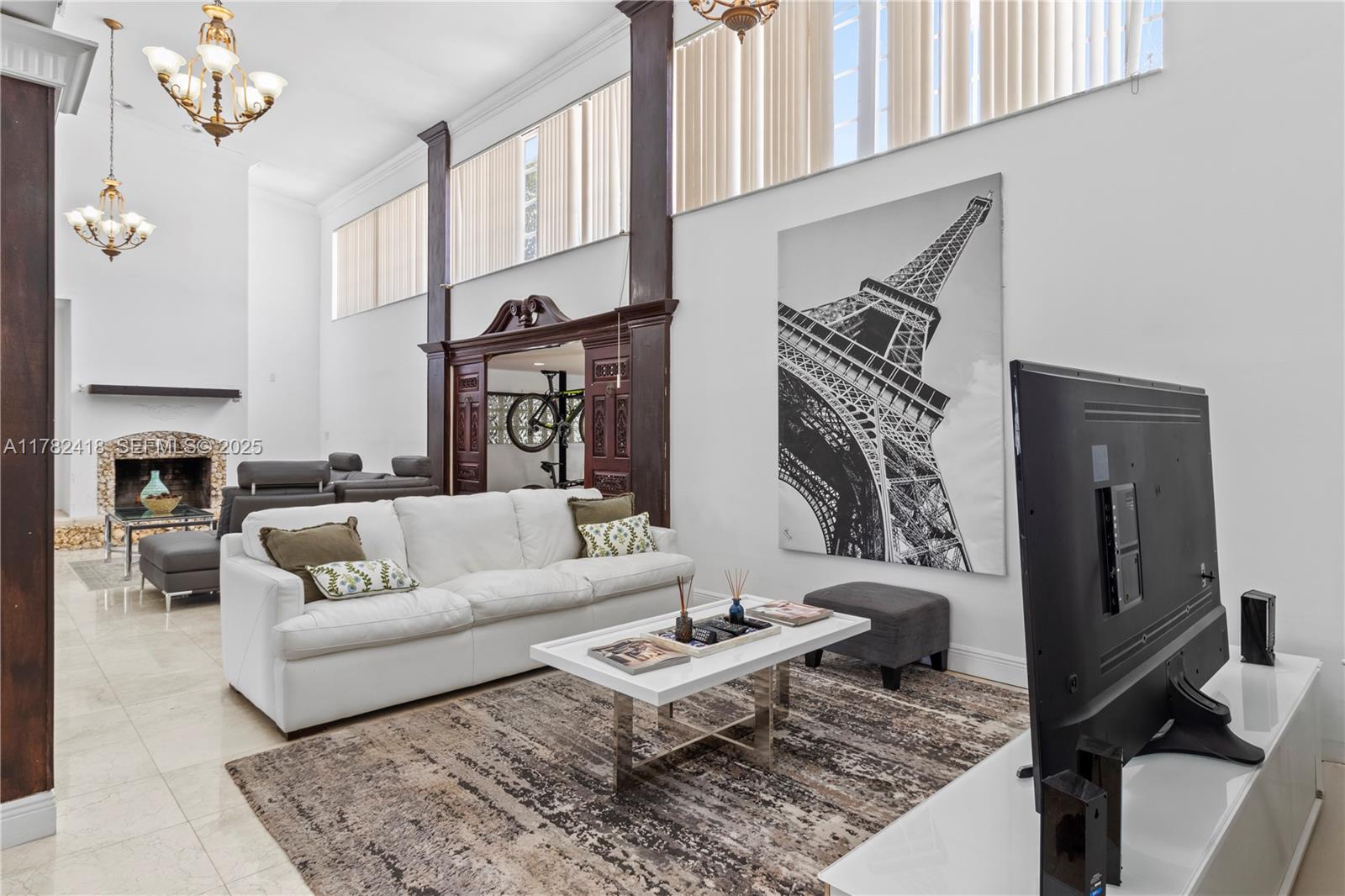 8350 Southwest 98th Street Miami, FL 33156 - Photo 8 of 67 a living room with furniture and a fireplace