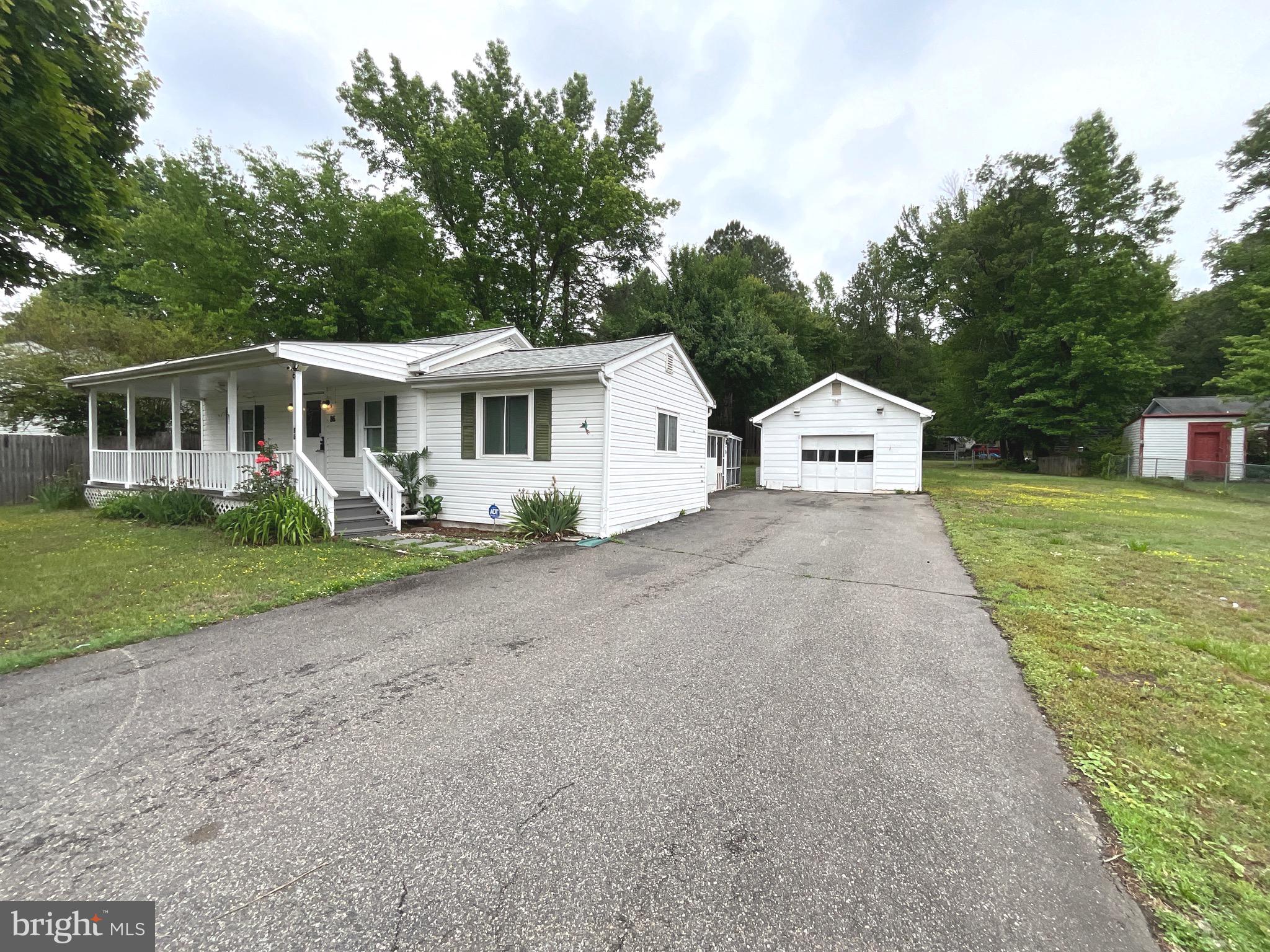 86 Kelley Road Fredericksburg, VA 22405 - Photo 34 of 36 a view of a house with a yard and potted plants