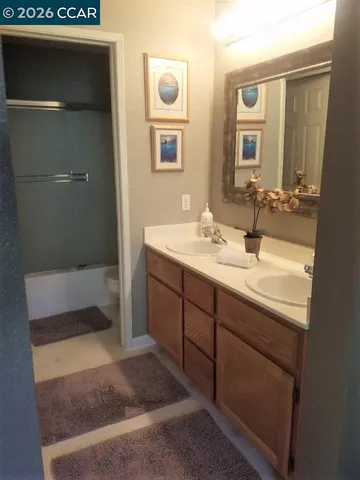 a bathroom with a sink and a mirror