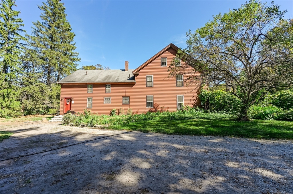 147 Shirley Street Pepperell, MA 01463 - Photo 13 of 42 a front view of a house with garden