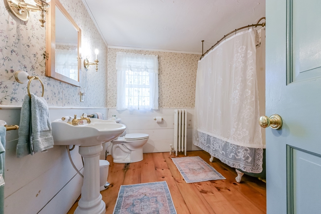 147 Shirley Street Pepperell, MA 01463 - Photo 22 of 42 a bathroom with a sink toilet and shower