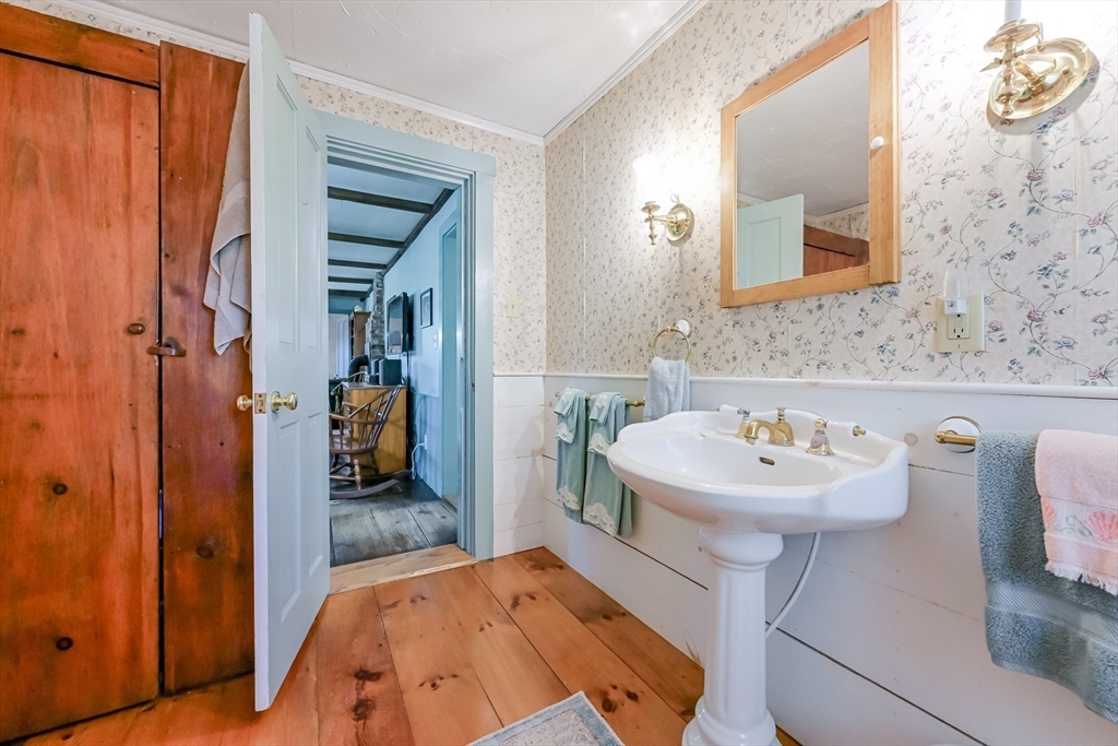 147 Shirley Street Pepperell, MA 01463 - Photo 23 of 42 a bathroom with a sink a mirror and shower
