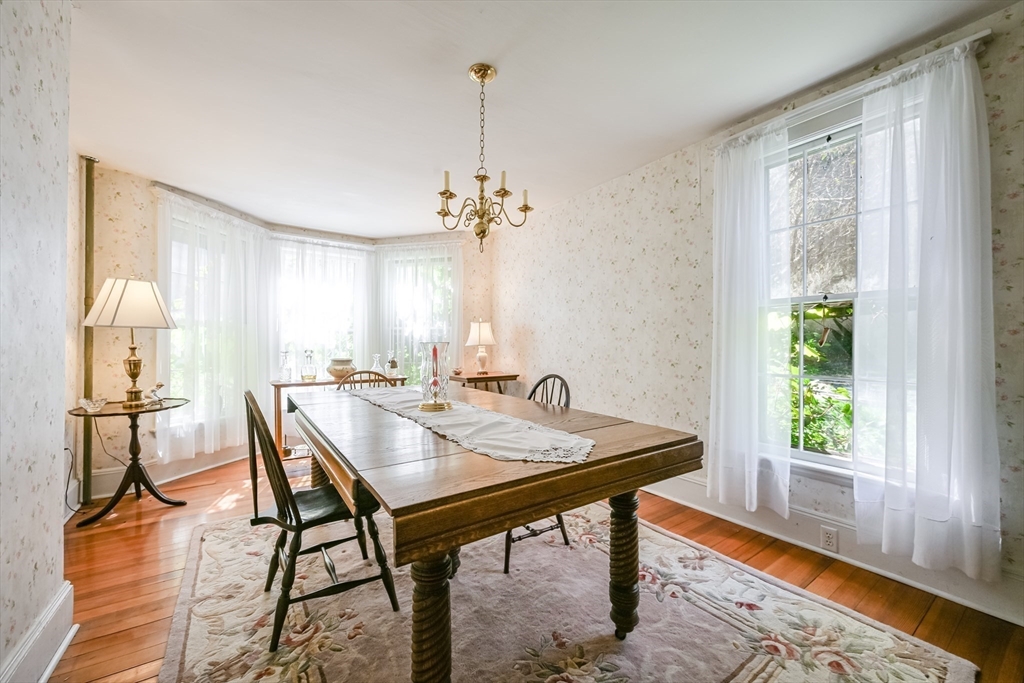 147 Shirley Street Pepperell, MA 01463 - Photo 27 of 42 a view of a dining room with furniture window and wooden floor