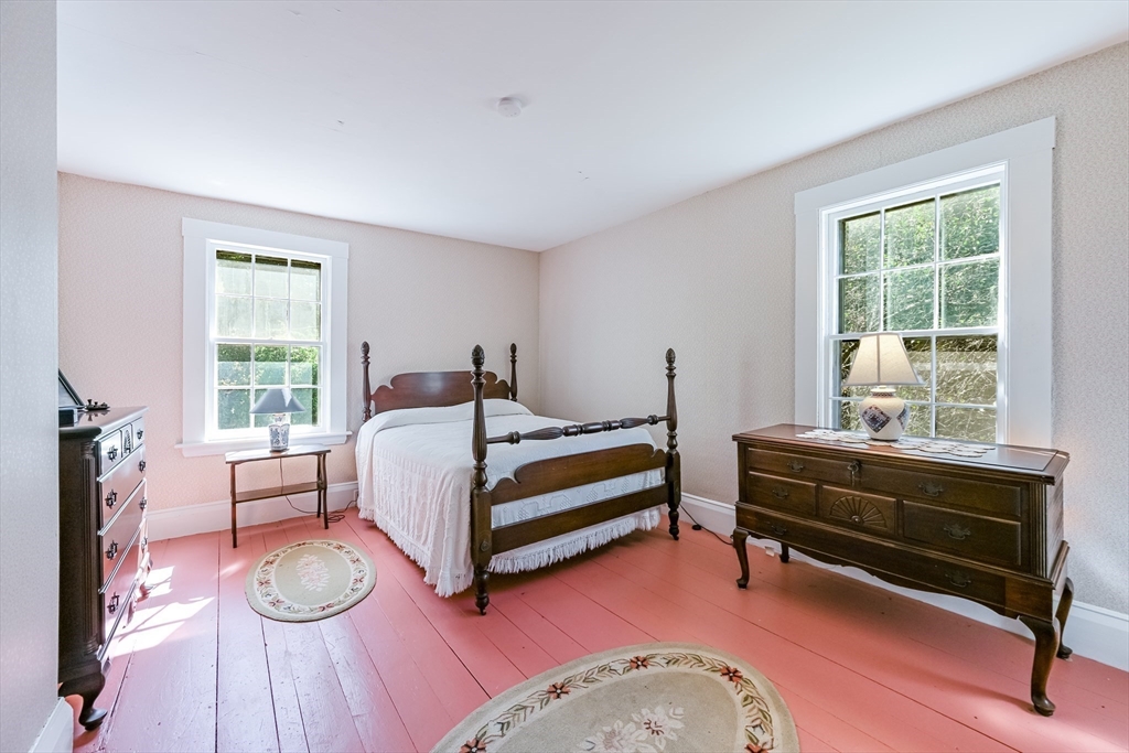 147 Shirley Street Pepperell, MA 01463 - Photo 34 of 42 a bedroom with furniture and a wooden floor