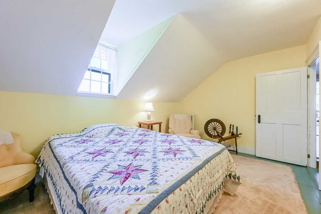 147 Shirley Street Pepperell, MA 01463 - Photo 36 of 42 a bedroom with a bed and a dresser