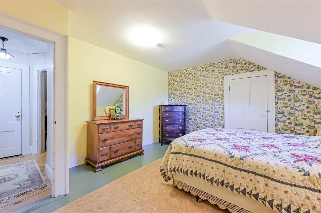 147 Shirley Street Pepperell, MA 01463 - Photo 37 of 42 a bedroom with a bed and a dresser