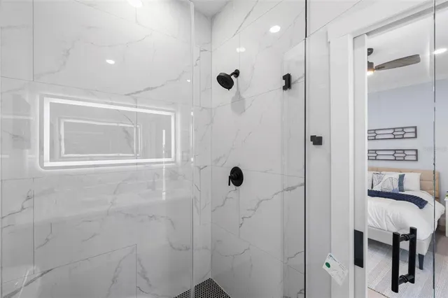 a bathroom with a bathtub and a shower