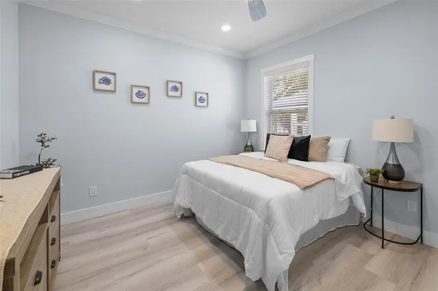 a bedroom with a bed and a table