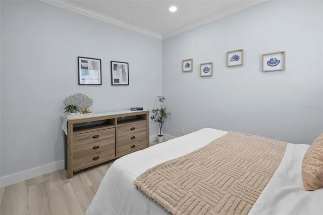a bedroom with a bed and a dresser
