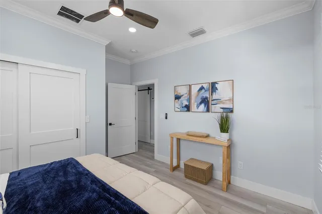 a bedroom with a bed and a fireplace