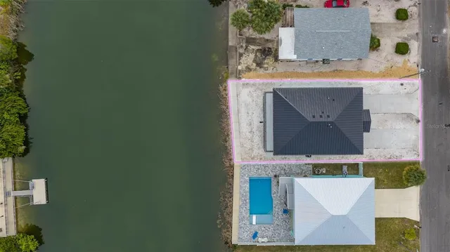 view of living room with a fireplace and a potted plant
