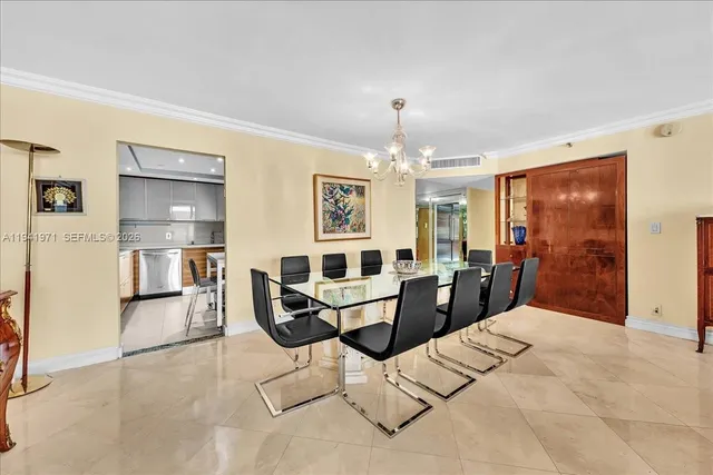 a view of a livingroom with furniture and chandelier