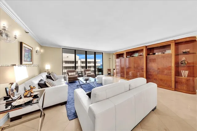 a view of a livingroom with furniture and chandelier