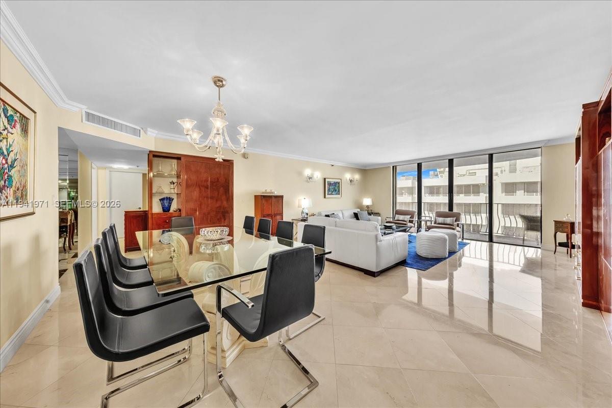 8877 Collins Avenue, Unit PH2 Surfside, FL 33154 - Photo 22 of 52 a room with lots of chairs and mirrors