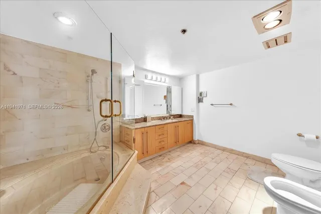 a bathroom with a tub and shower