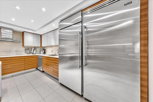 a kitchen with granite countertop stainless steel appliances and counter space