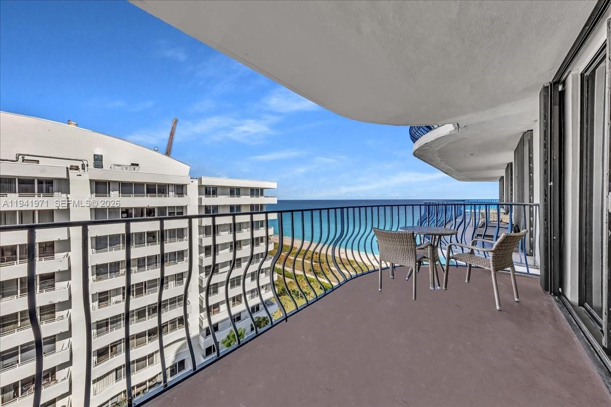 8877 Collins Avenue, Unit PH2 Surfside, FL 33154 - Photo 7 of 52 a view of a balcony with chairs