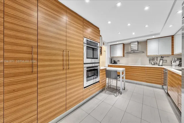 a kitchen with granite countertop stainless steel appliances and counter space