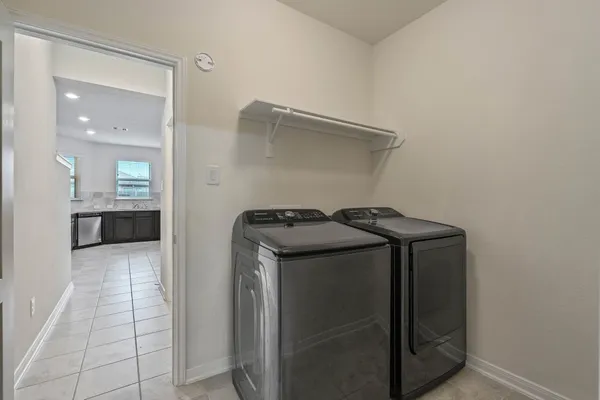 a utility room with washer and dryer
