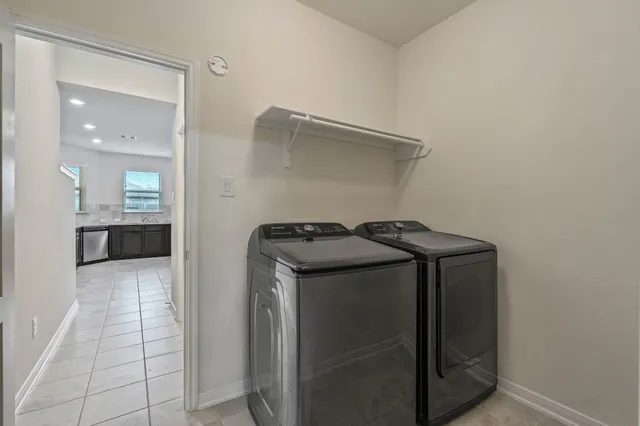 a utility room with washer and dryer