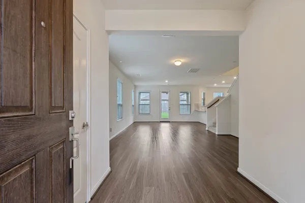 a view of gallery with wooden floor