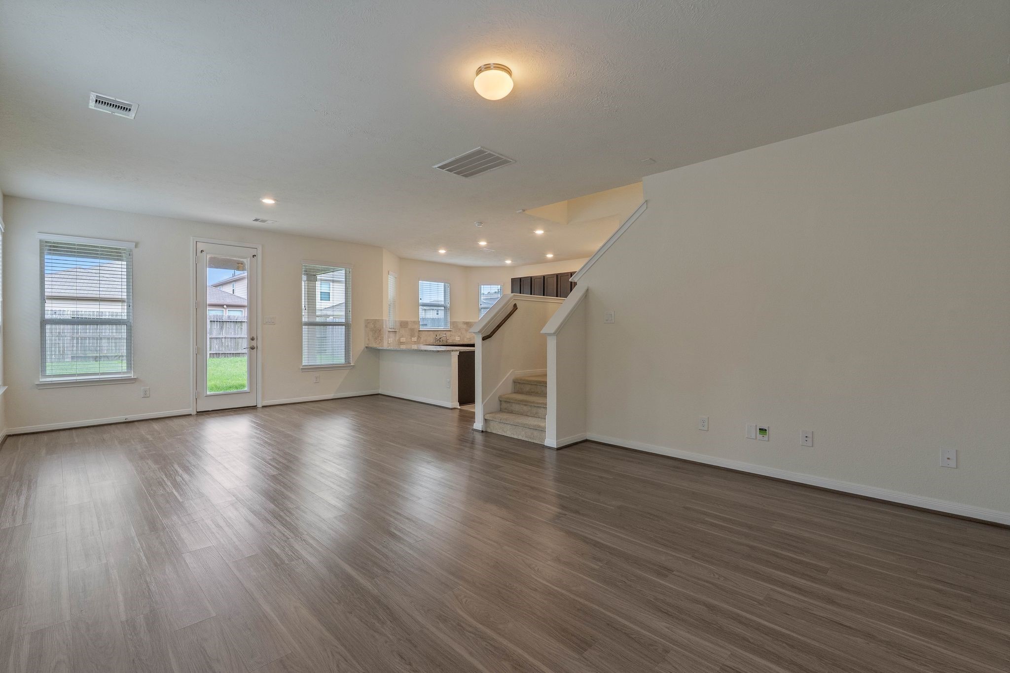 16623 Cliff Vale Court Houston, TX 77084 - Photo 6 of 34 a view of an empty room with wooden floor and a window