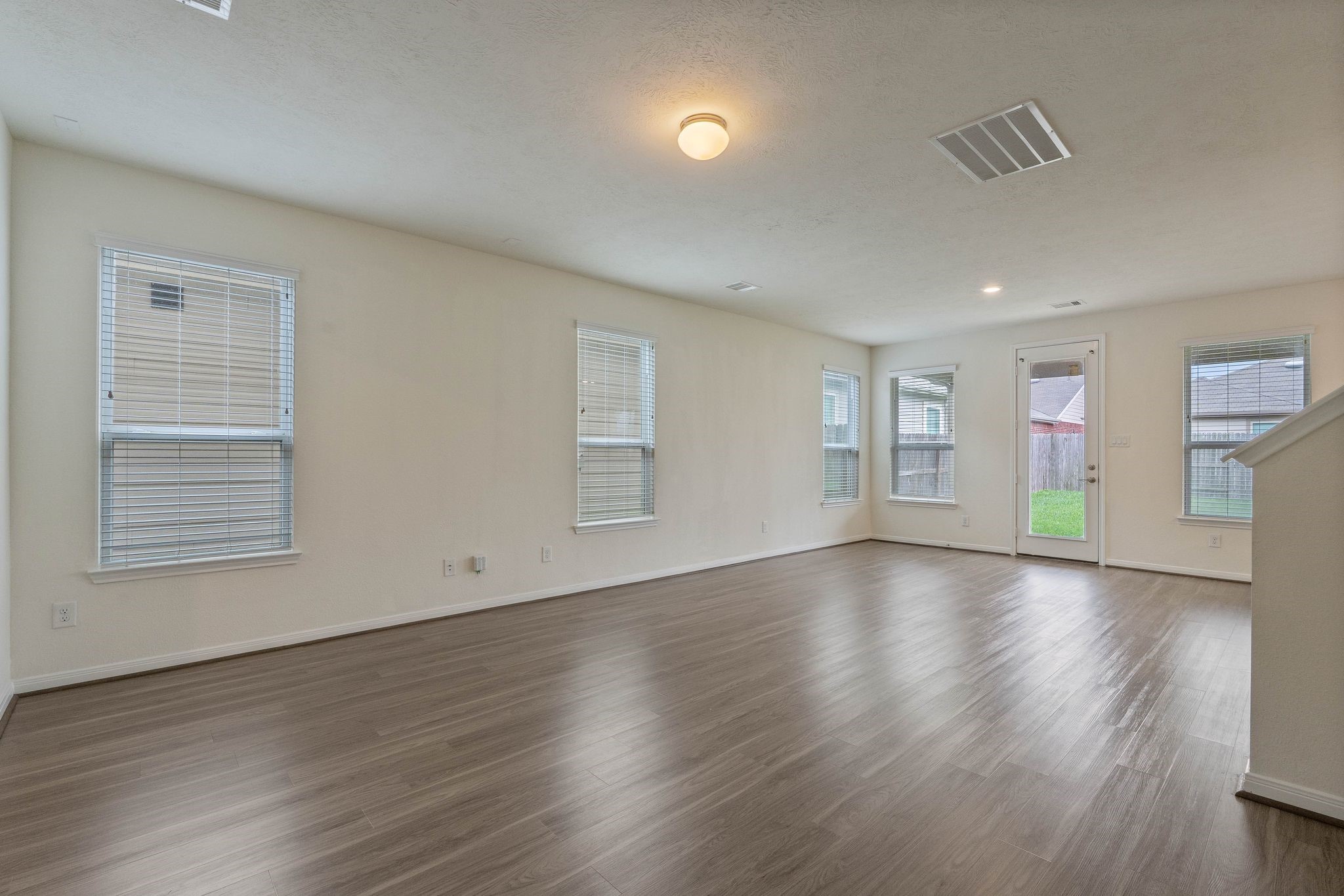 16623 Cliff Vale Court Houston, TX 77084 - Photo 7 of 34 a view of an empty room with wooden floor and a window