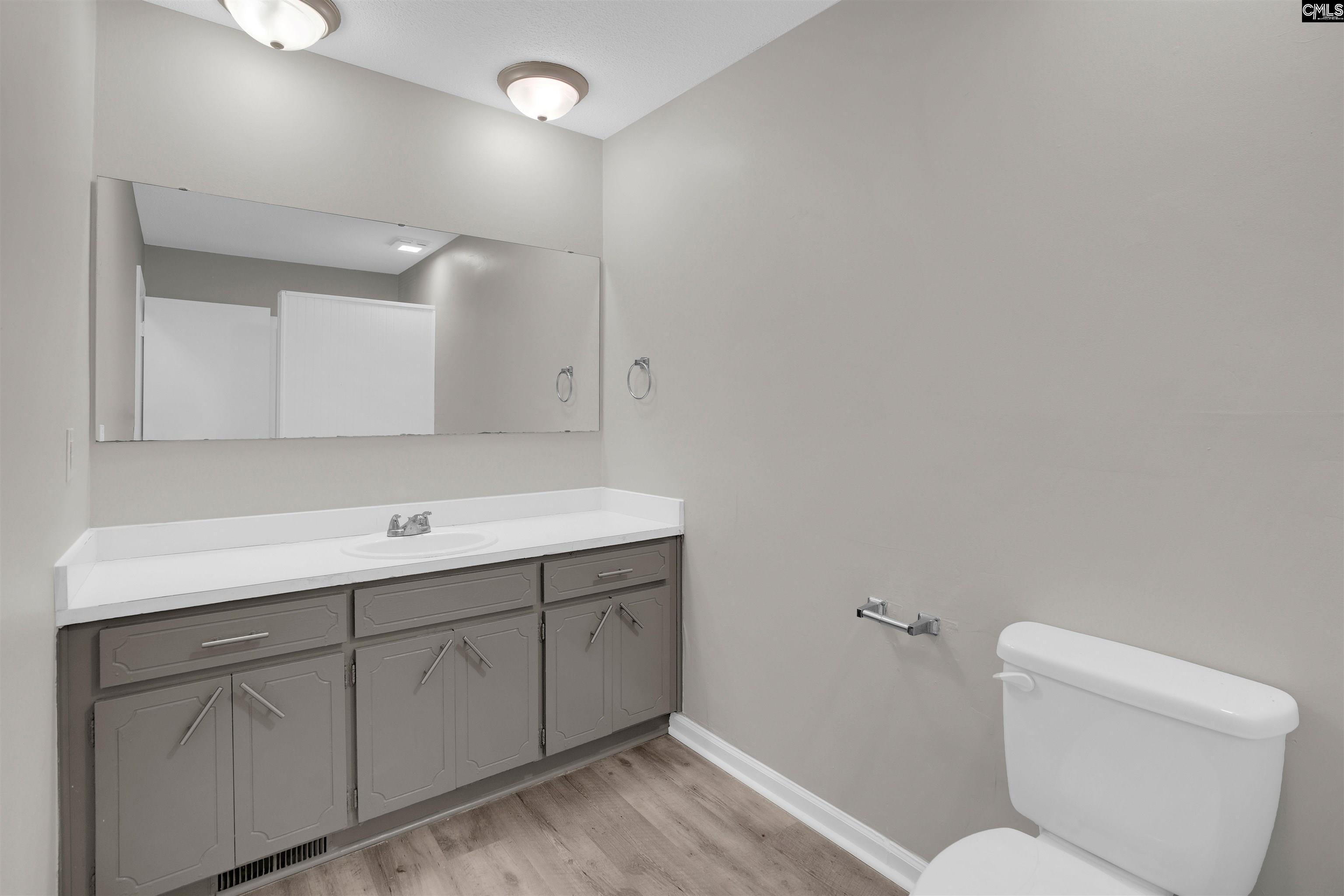 2620 Pleasant Ridge Drive Columbia, SC 29209 - Photo 31 of 37 a bathroom with a toilet sink and mirror