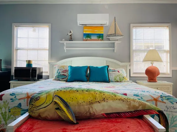 a bedroom with a bed and dresser