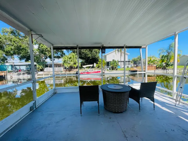 a room with furniture and a view of lake
