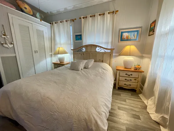 a bedroom with a bed and a cabinets