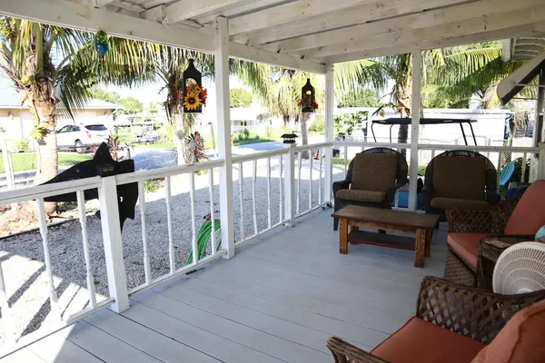 a lake view with outdoor seating