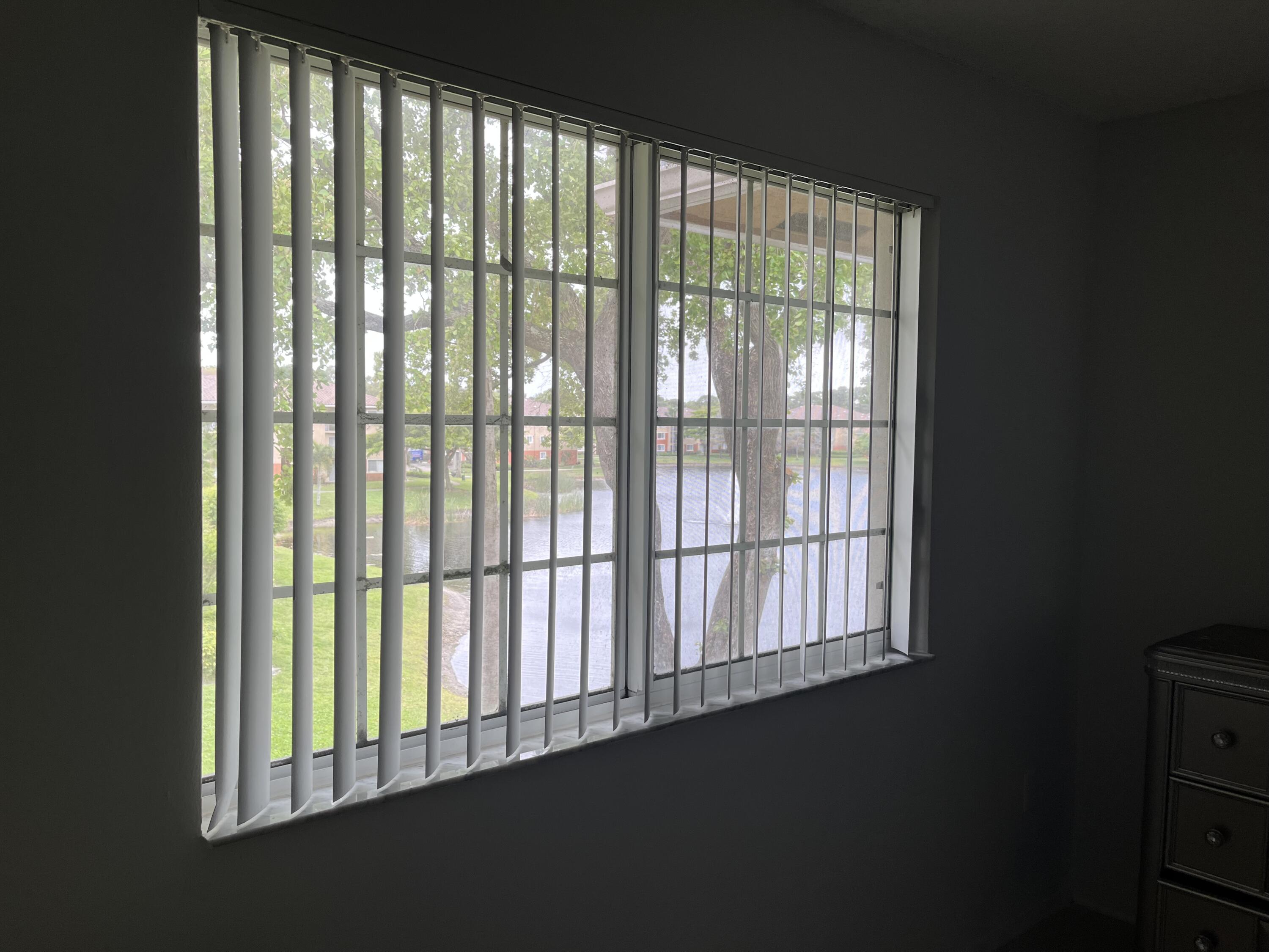 4191 Haverhill Road, Unit 409 West Palm Beach, FL 33417 - Photo 12 of 17 a view of an empty room with a window