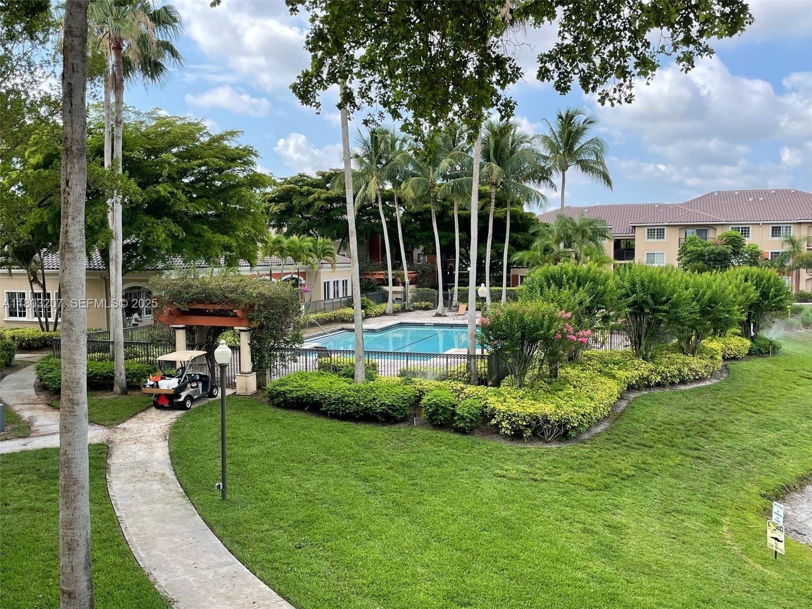 4191 Haverhill Road, Unit 409 West Palm Beach, FL 33417 - Photo 16 of 17 a view of a house with a yard porch and sitting area