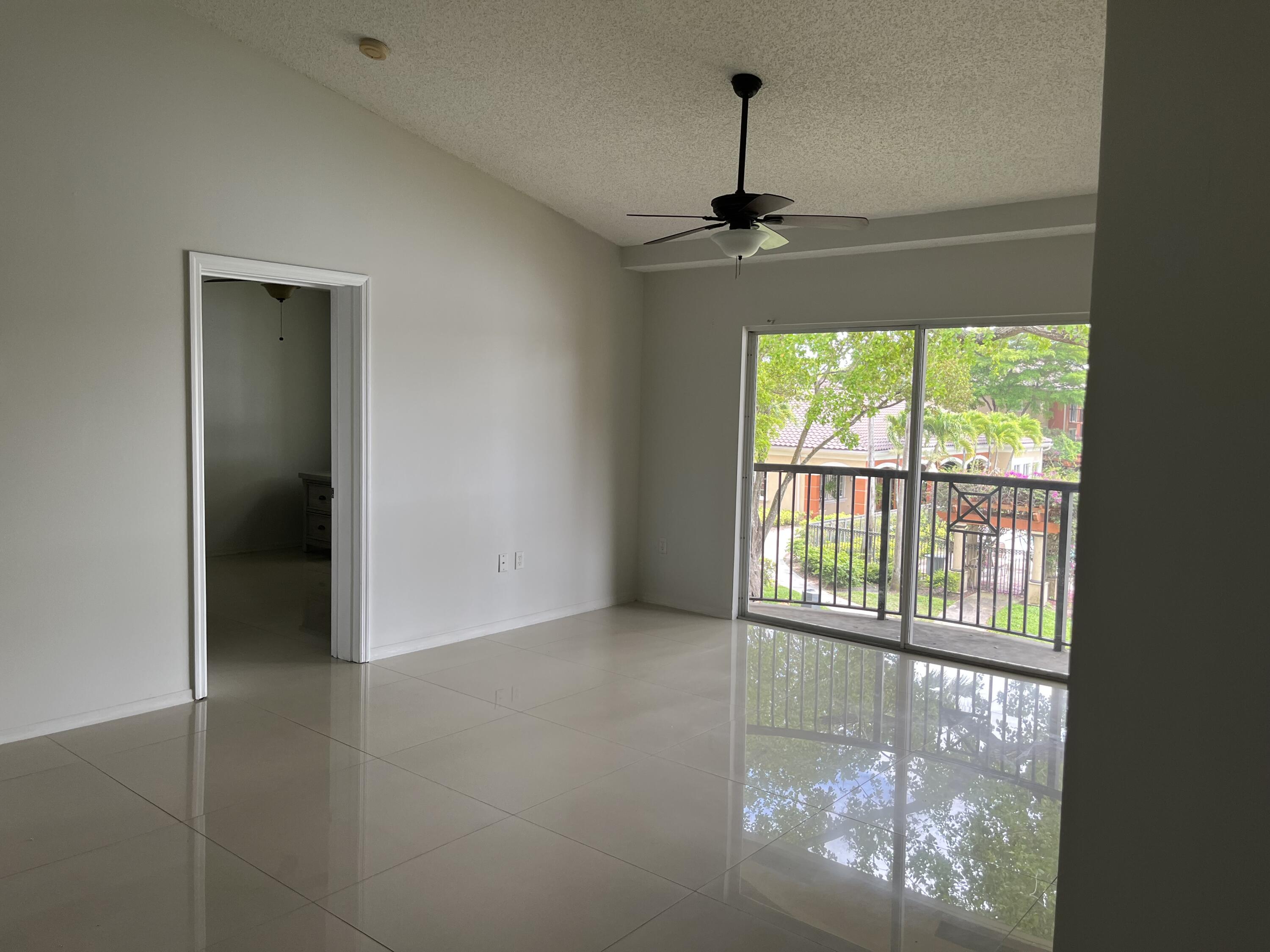 4191 Haverhill Road, Unit 409 West Palm Beach, FL 33417 - Photo 5 of 17 a view of an empty room with a window