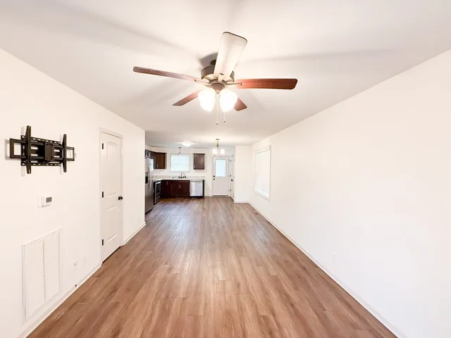 a view of a livingroom with wooden floor