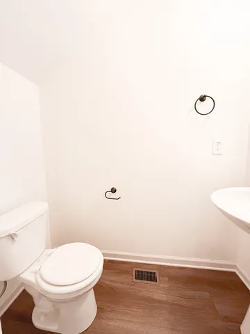 a bathroom with a toilet and a sink