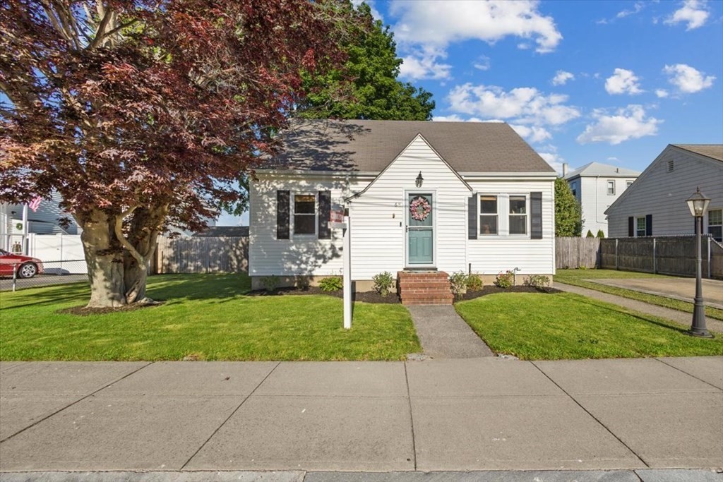 68 Congress Street Fall River, MA 02721 - Photo 1 of 38 a front view of a house with a garden