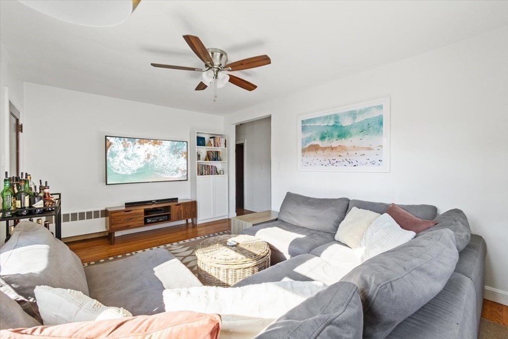 68 Congress Street Fall River, MA 02721 - Photo 14 of 38 a living room with furniture and a wooden floor