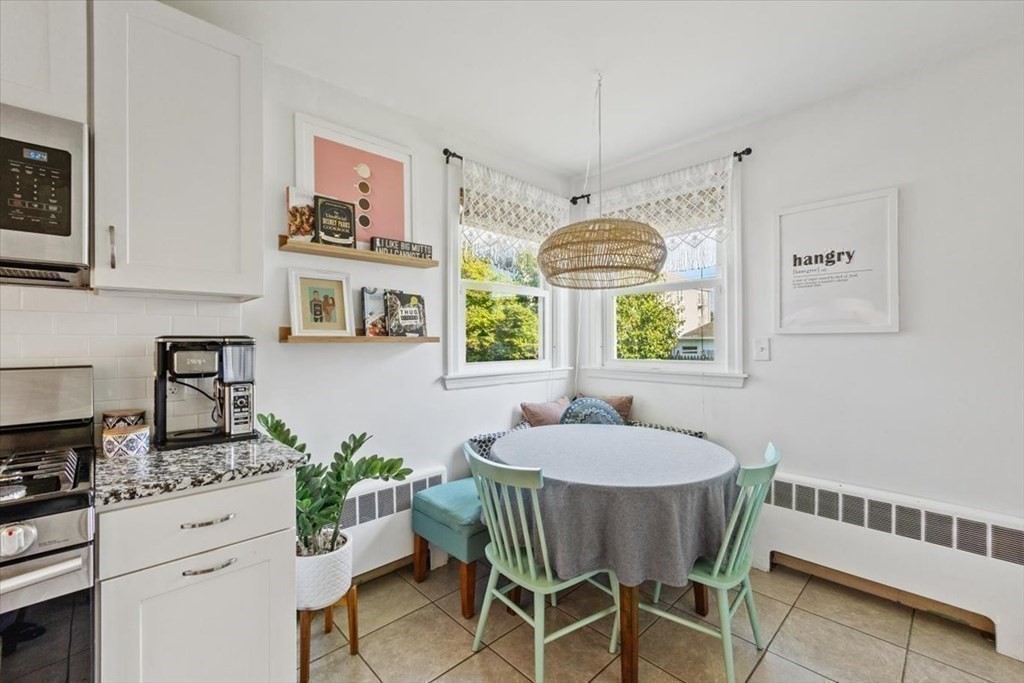68 Congress Street Fall River, MA 02721 - Photo 17 of 38 a dining room with furniture a window and a chandelier
